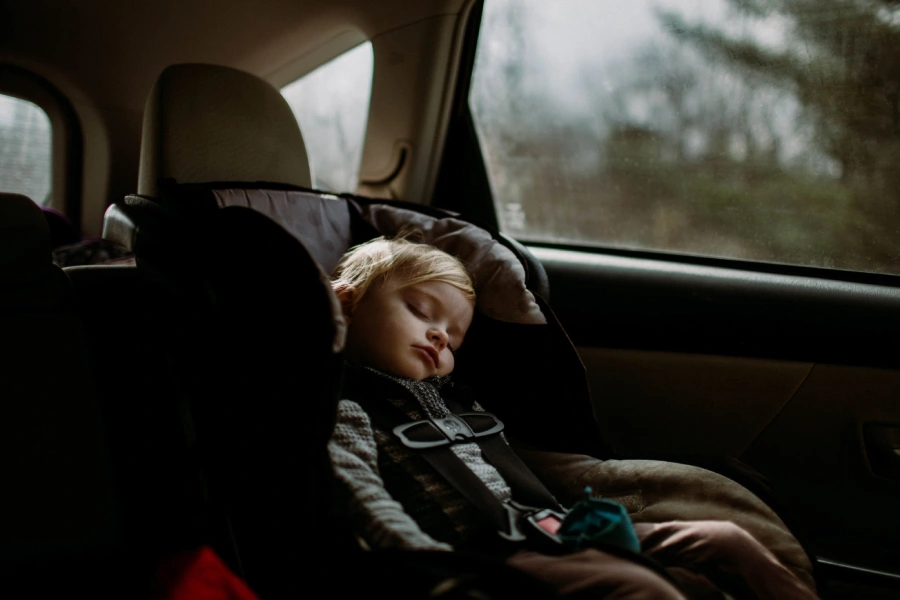 toddler sleeping in car seat